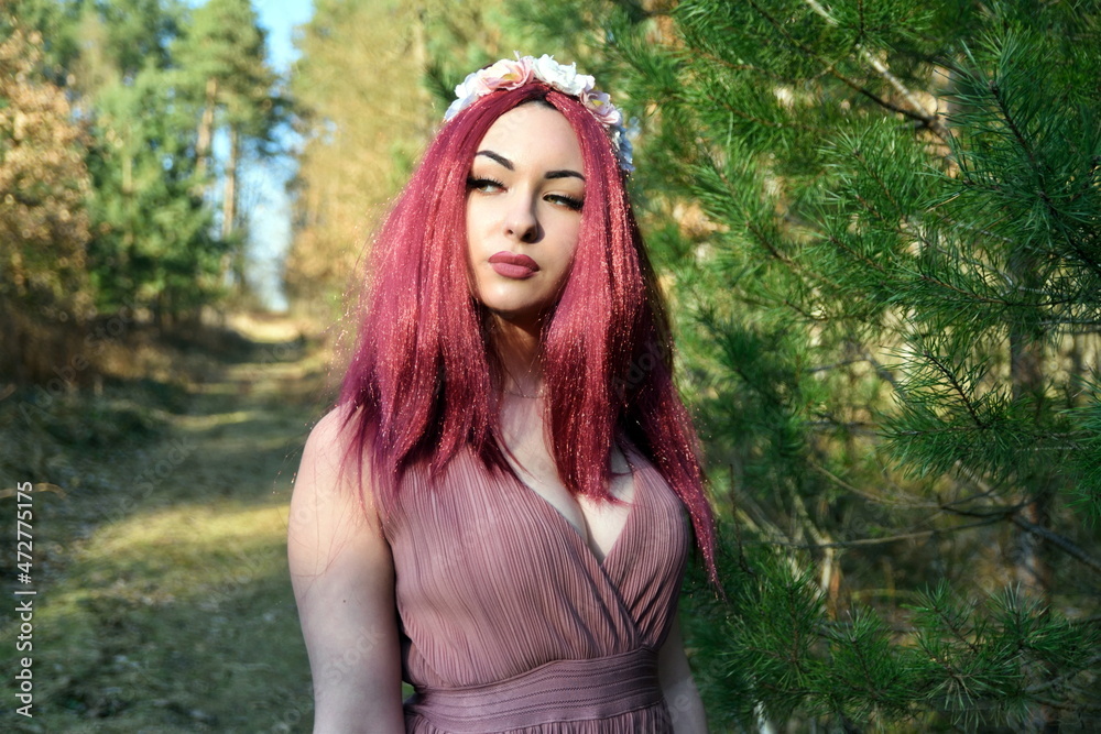 Female model in forest, daytime photo session. Young woman with red hairs, princess style. Female model in forest, daytime photo session. Young woman with red hairs, princess style.