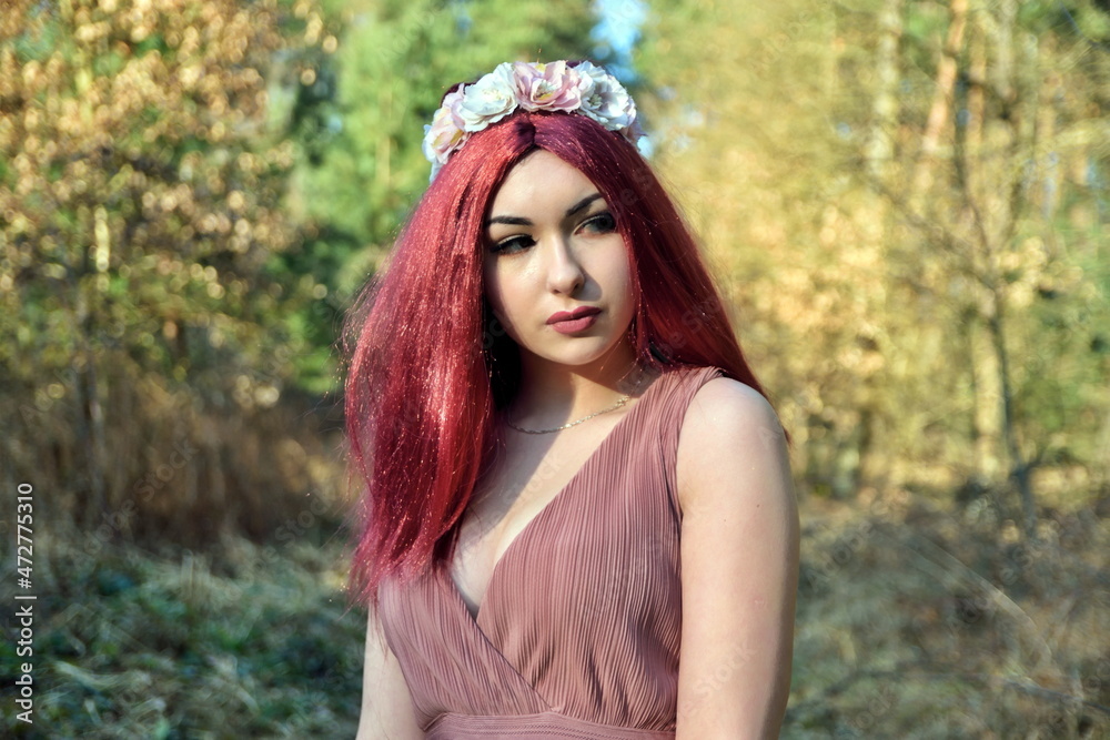 Female model in forest, daytime photo session. Young woman with red hairs, princess style. Female model in forest, daytime photo session. Young woman with red hairs, princess style.