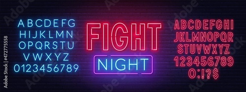 Fight Night neon sign on a brick background.