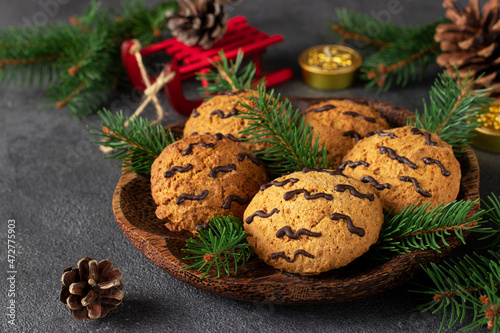 Homemade cookies for Tiger New Year 2022 on wooden plate, Simple Holiday Baking Culinary Idea