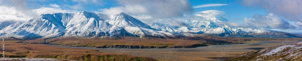 USA, Alaska. Panoramic view of Fall colors in Denali National Park with clouds shrouding Mt. Denali, formerly known as Mt. McKinley.