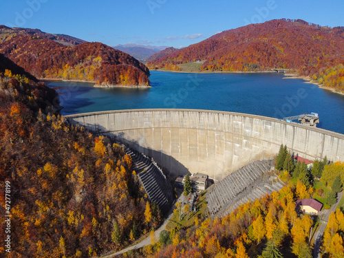 Paltinu water dam in Prahova County , Romania , the lake and forests around it in autumn colors , aerial drone image