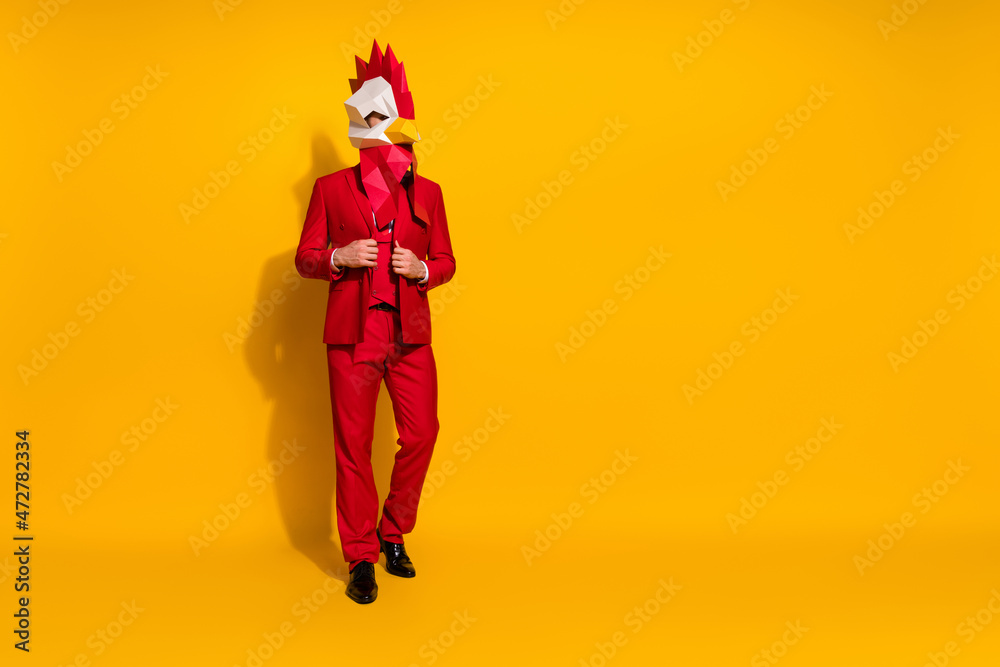 Photo of luxury agent prepare event outfit wear chicken polygonal mask red tux isolated yellow color background Photo of luxury agent prepare event outfit wear chicken polygonal mask red tux isolated yellow color background