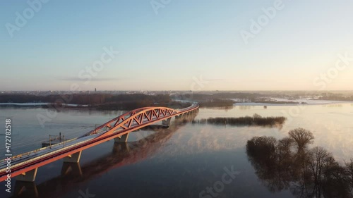 Wallpaper Mural Foggy winter sunrise over the river IJssel with a high water level and ice and snow during a cold day in The Netherlands. Aerial drone point of view. Torontodigital.ca