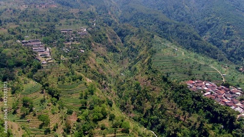 Drone flying over Umbul Sidomukti valley in Ambarawa, Indonesia. Aerial backward photo