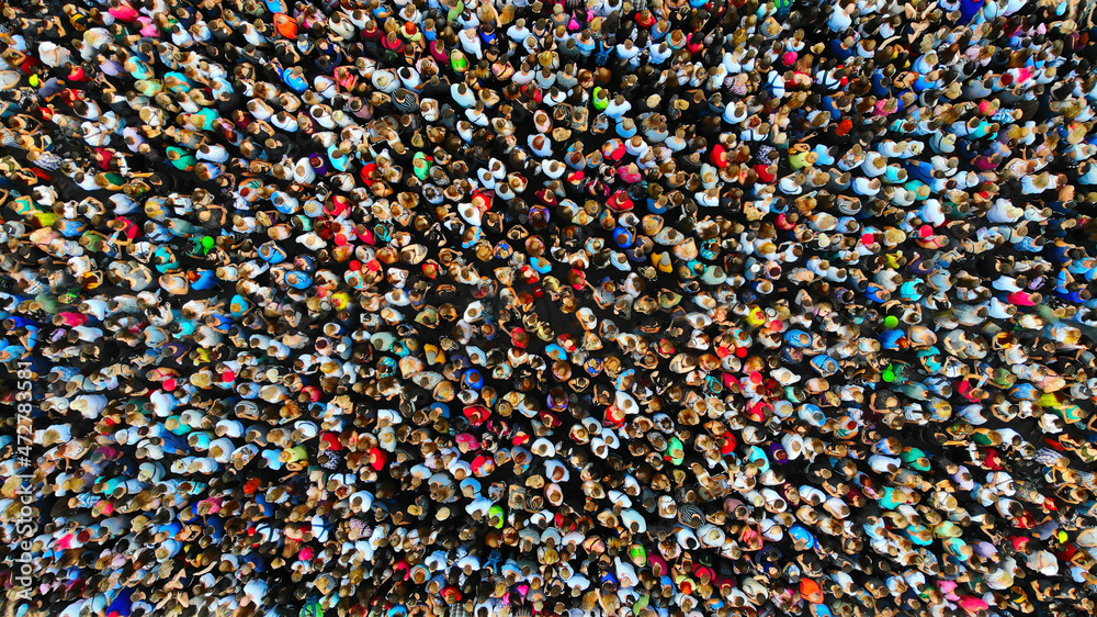 Big crowd of people. People gathered together in one place. Top view from drone. - obrazy, fototapety, plakaty 