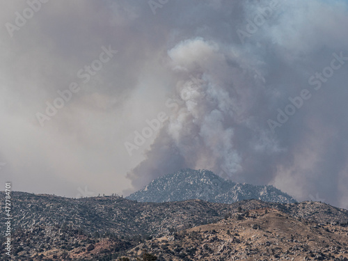 Smoke from wildfire behind Black Mountain, Southern Sierra Nevada Mountains, California, from drought stressed forest