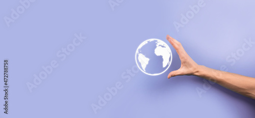 Businessman man hand holding Earth icon , digital globe. © Ivan