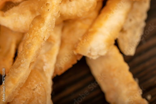 Fried breadsticks with salt, close-up, selective focus.