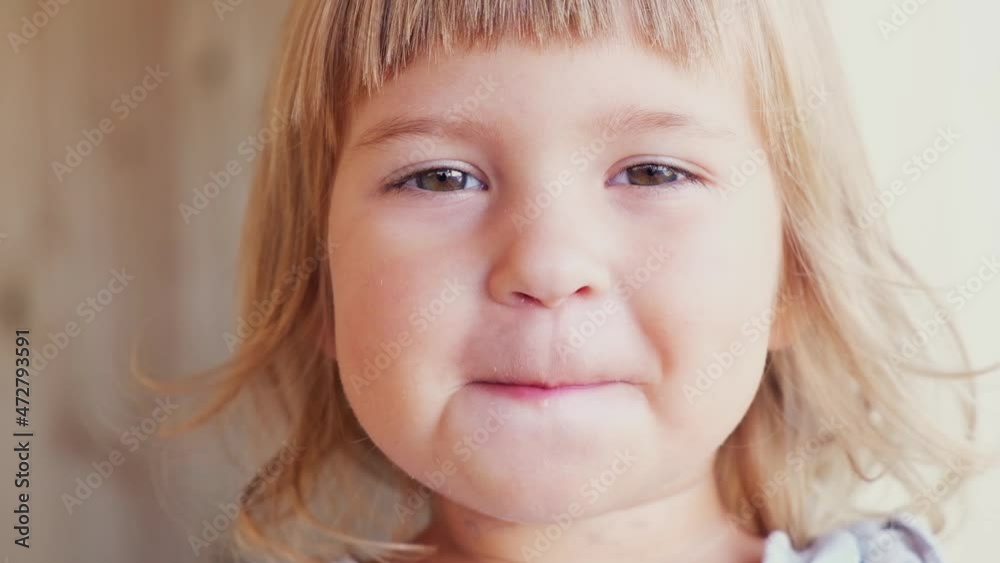 Pretty little girl with a bright lollipop. Studio shot Pretty little girl with a bright lollipop. Studio shot