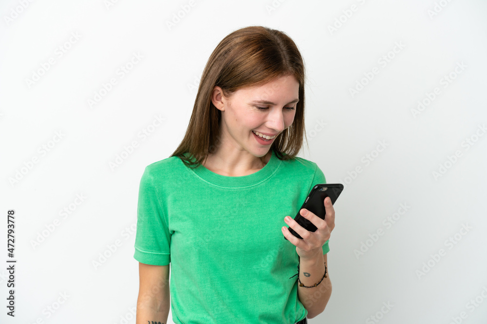 Young English woman isolated on white background sending a message or email with the mobile Young English woman isolated on white background sending a message or email with the mobile