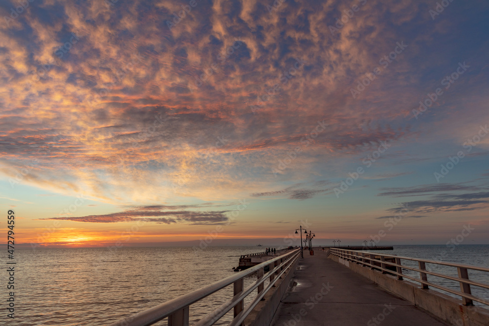 Vivid sunrise clouds over the Atlantic Ocean from Higgs Beach Pier in Key West, Florida, USA