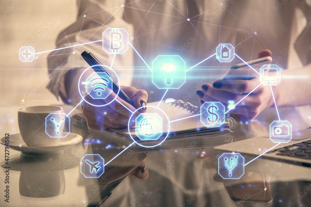 Double exposure of social network sketch hologram and woman holding and using a mobile device. Double exposure of social network sketch hologram and woman holding and using a mobile device.