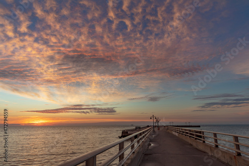 Vivid sunrise clouds over the Atlantic Ocean from Higgs Beach Pier in Key West, Florida, USA