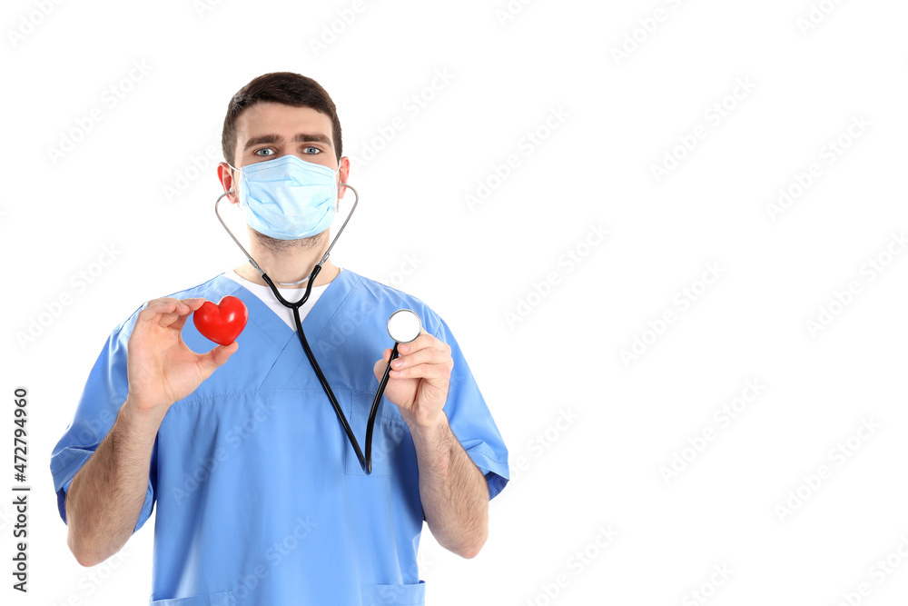 Nurse man holds heart, isolated on white background Nurse man holds heart, isolated on white background