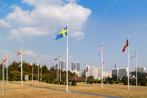 The United Nations Memorial Cemetery, located in Busan, South Korea,flutters the flags of countries that participated in the 1950 Korean War.