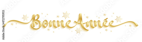 Banniere calligraphique dorée vecteur BONNE ANNEE avec flocons de neige