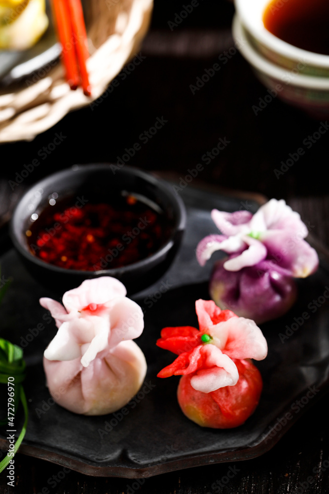 Chinese Dumpling, Beautiful Colorful Dim Sum on Bamboo Stemaer. Concept Chinese Snack (Dim Sum) Served with Tea at Family Gathering during Chinese Festival, Dongzhi, Lantern, New Year, Mid Autumn