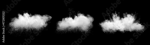 White powder explosion cloud against black background.White dust particles splash