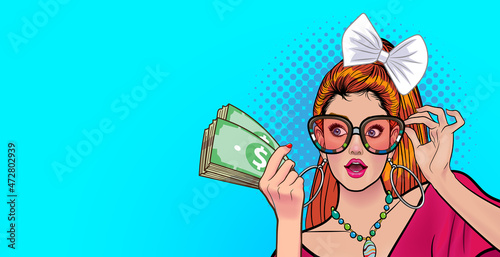 pretty woman in glasses hold and looking her money