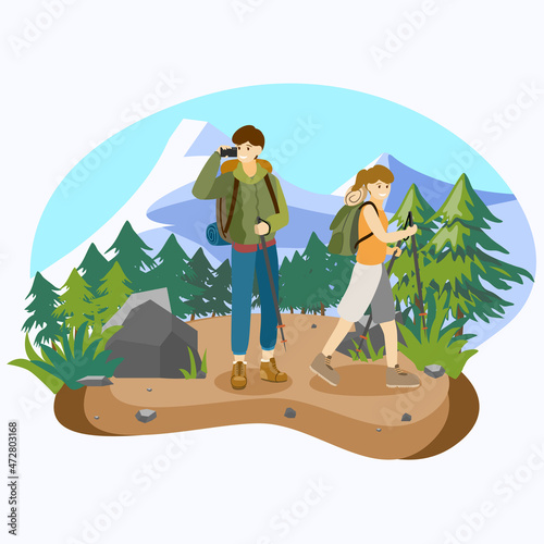 A boy and a girl with backpack trekking or hiking in mountain background.