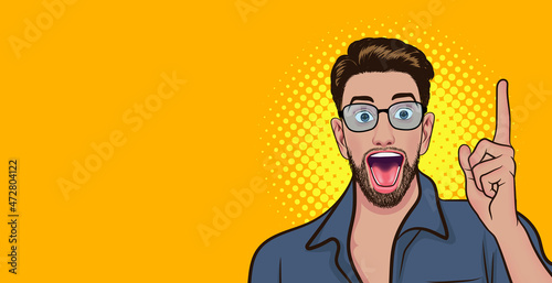 Surprised idea bearded young man point finger up