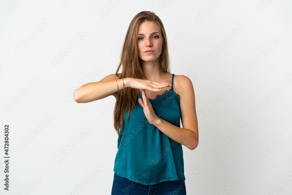Young caucasian woman over isolated background making time out gesture Young caucasian woman over isolated background making time out gesture