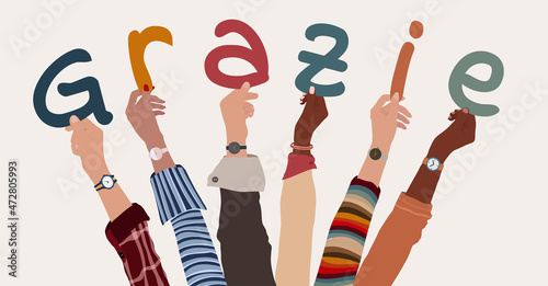 Raised arms of a group of multiethnic people holding the letters that form the Italian word -thank you- in their hands. Teamwork. Gratitude and agreement between colleagues.Appreciation