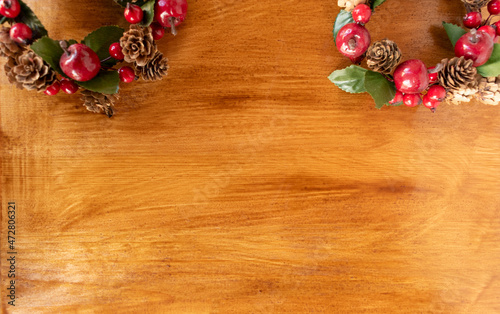 christmas garlands on wooden background