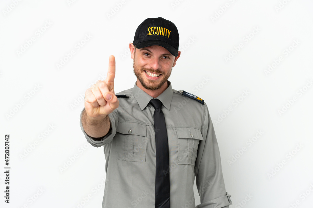 Young security Brazilian man isolated on white background showing and lifting a finger Young security Brazilian man isolated on white background showing and lifting a finger