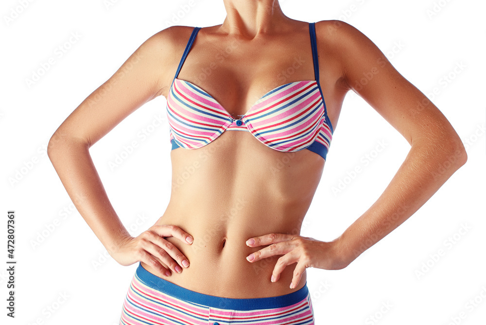 Close up studio shot of  slim female body wearing underwear. Isolated on white background.
