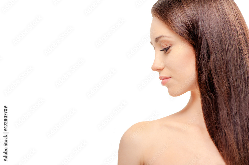 Natural beauty. Portrait of beautiful young woman looking at her shoulder while standing against white background. Natural beauty. Portrait of beautiful young woman looking at her shoulder while standing against white background.