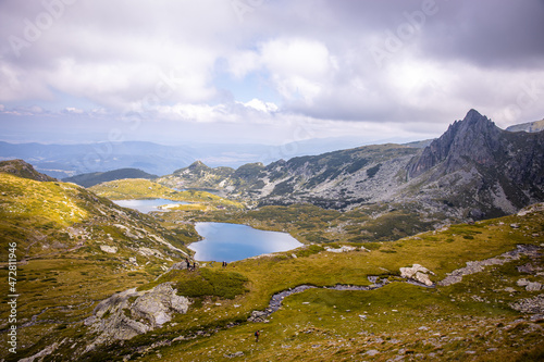 Beautiful landscape of the Seven Rila Lakes,Bulgaria. Amazing nature shot, mountains and lake.Reflecting water on sunny cloudy day. High quality photo