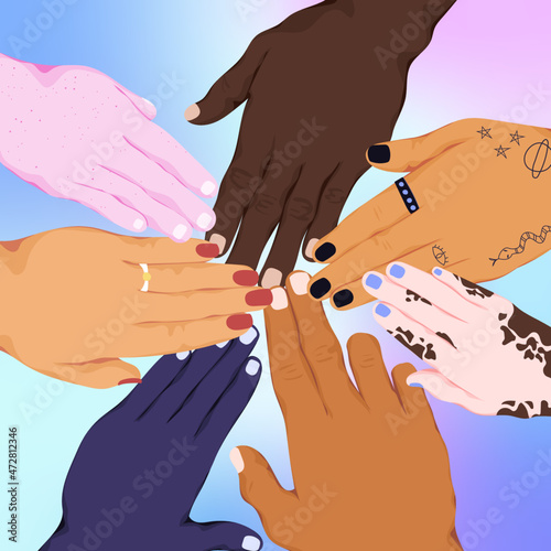 Group of people from different ethnicities put hands together