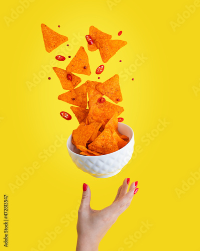 Obraz na plátně Levitation or flying of spicy hot Nachos mexican crispy crunchy tortilla chips w