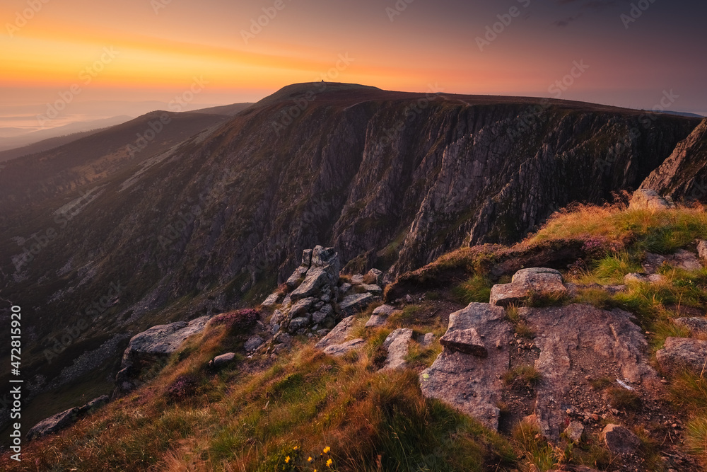 Summer views in the Karkonosze Mountains during the August sunrise. Hiking in the National Park. Summer views in the Karkonosze Mountains during the August sunrise. Hiking in the National Park.
