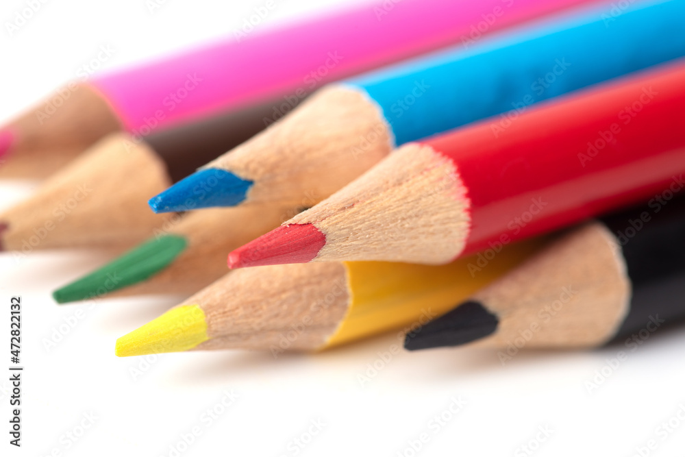 Multi-colored pencils on a white background. Multi-colored pencils on a white background.
