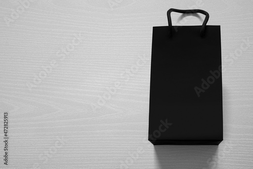 Photography Luxurious shopping bag against white wood