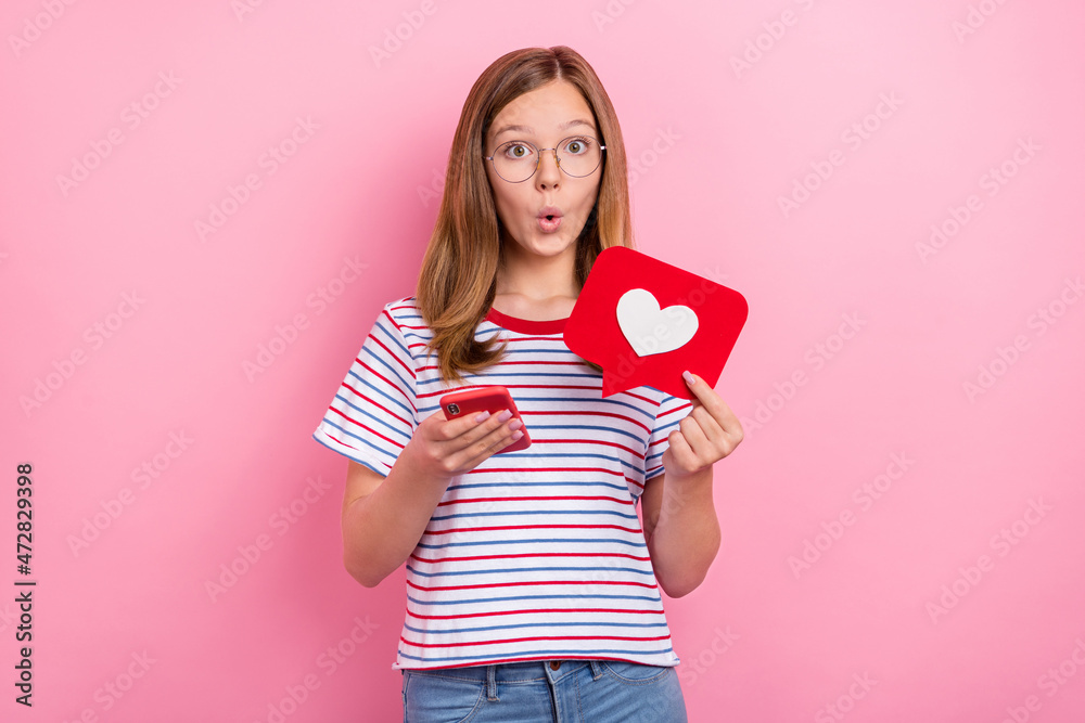 Photo of hooray small little brown hairdo girl hold telephone ad wear spectacles t-shirt isolated on pink color background Photo of hooray small little brown hairdo girl hold telephone ad wear spectacles t-shirt isolated on pink color background