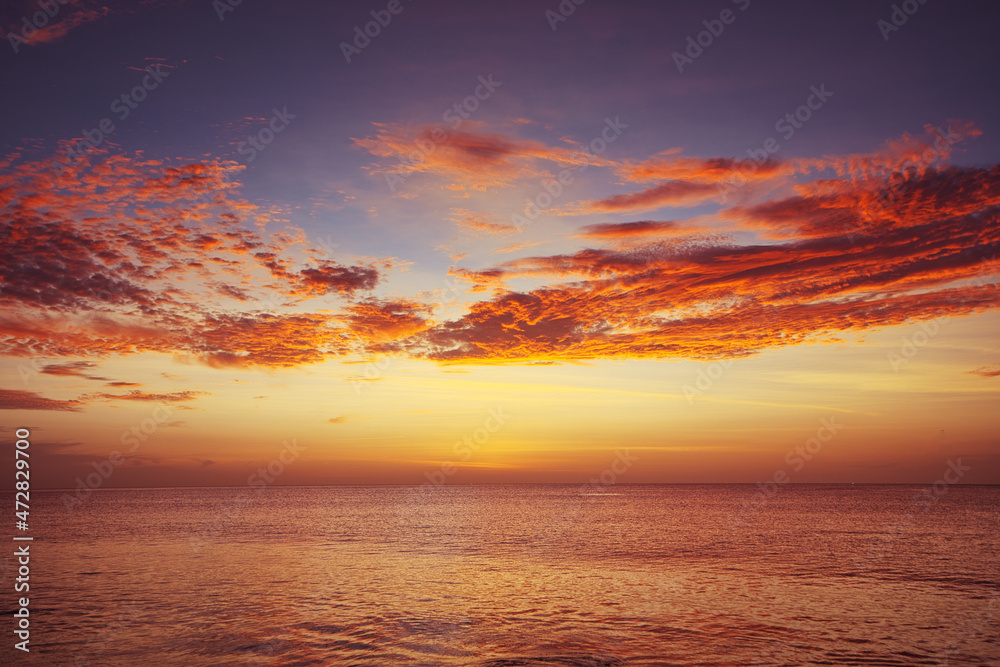 Beautiful seascape with sunset cloudy sky.