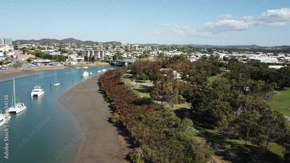 Drone aerial slow pan over blue harbour with ships on a sunny day Drone aerial slow pan over blue harbour with ships on a sunny day