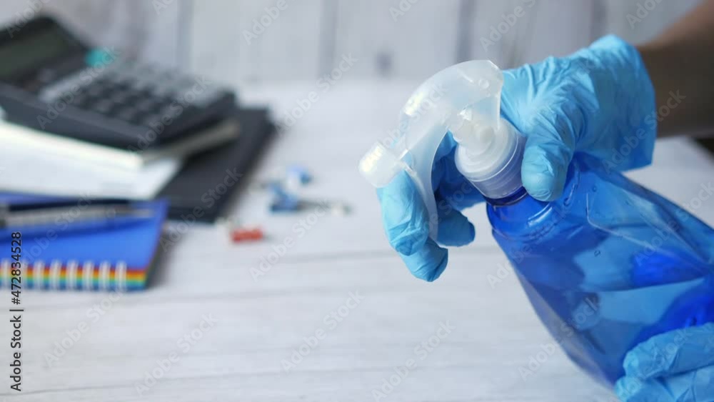 using disinfectant spray to clean table surface using disinfectant spray to clean table surface