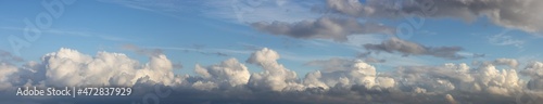 Panoramic View of Cloudscape during a cloudy blue sky sunny day. Taken on the West Coast of British Columbia, Canada.