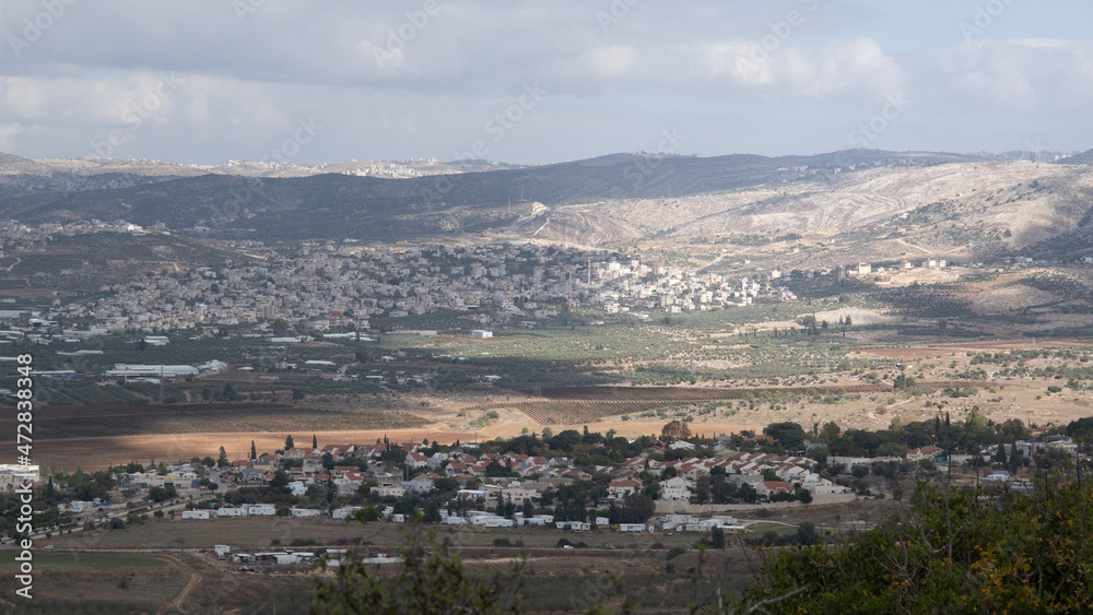 Northbound view of Ayalon Valley with Mevo Horon settlement and Bayt Sira village in West Bank as seen from one of Ayalon-Canada National Park northeastern panoramic hilltops, Israel.