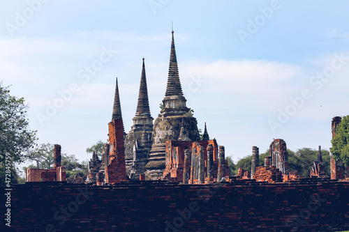 Majestic ancient ruins in Wat Mahathat inside the famous heritage site of Ayutthaya Historical Park in Thailand