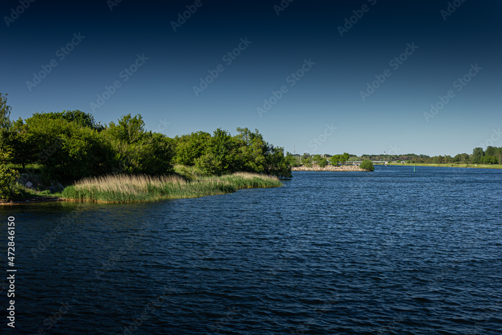 Denmark stock photo with clear skies, greenery and nature