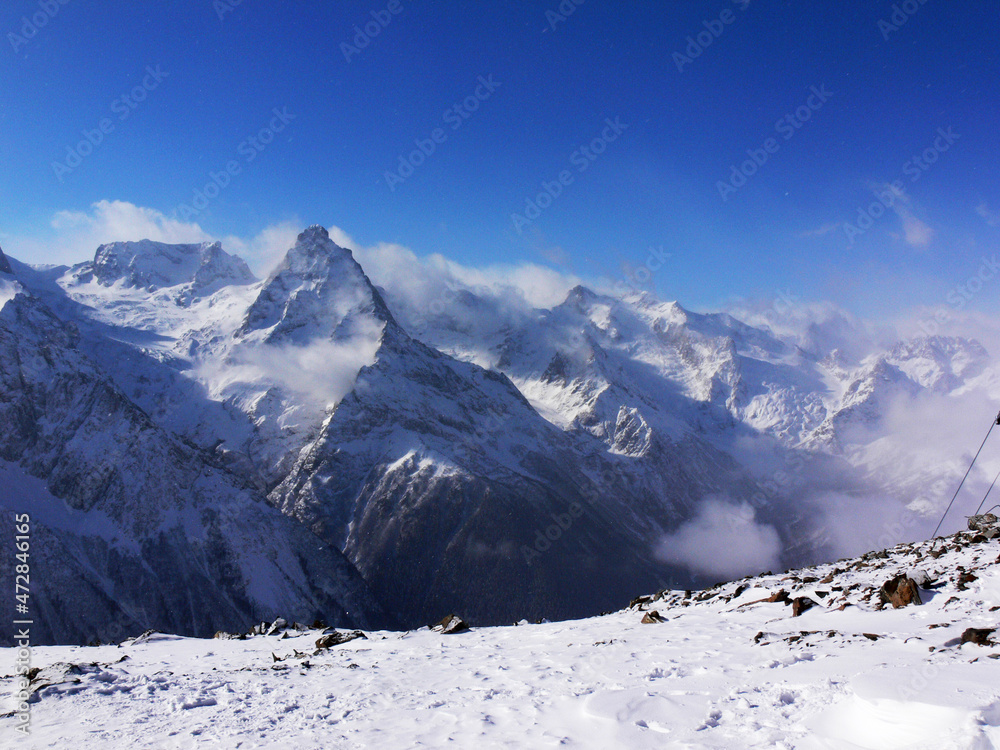 Snow peaks of beautiful winter mountains