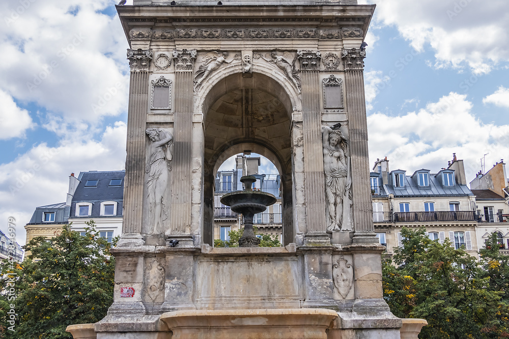 Obraz premium Fountain of the Innocents (Fontaine des Innocents, 1547 - 1550) at place Joachim-du-Bellay in Paris. Fountain of the Innocents is oldest monumental fountain in Paris, France.