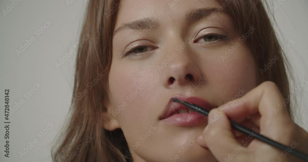 Young Woman Closing Eyes As Make Up Is Applied Young Woman Closing Eyes As Make Up Is Applied