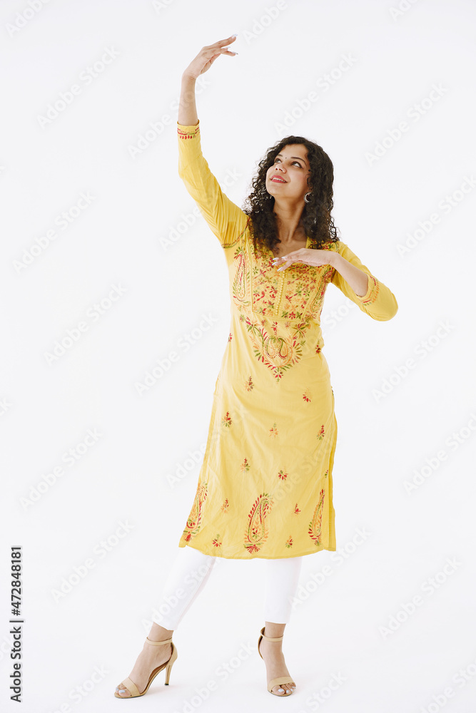 Woman in indian clothes showing dance move Woman in indian clothes showing dance move